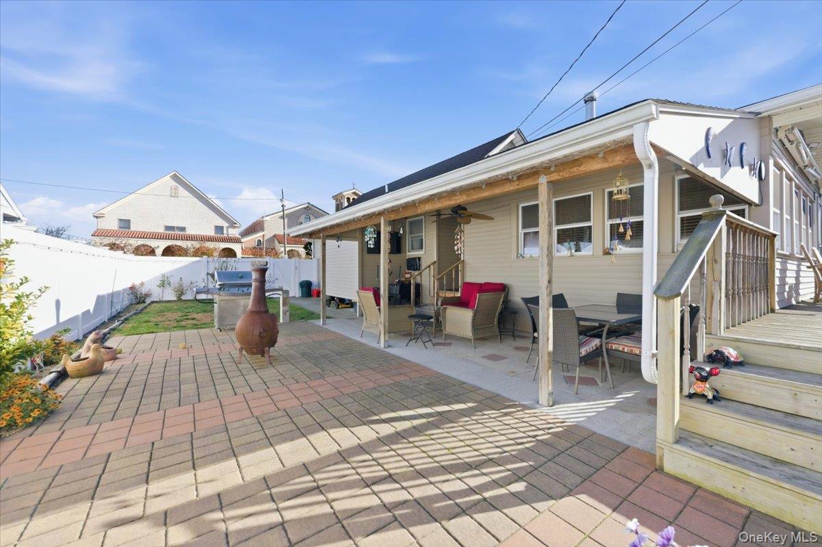 80 Newport Road Island Park, NY 11558 - Photo 22 of 26 a view of a house with a patio