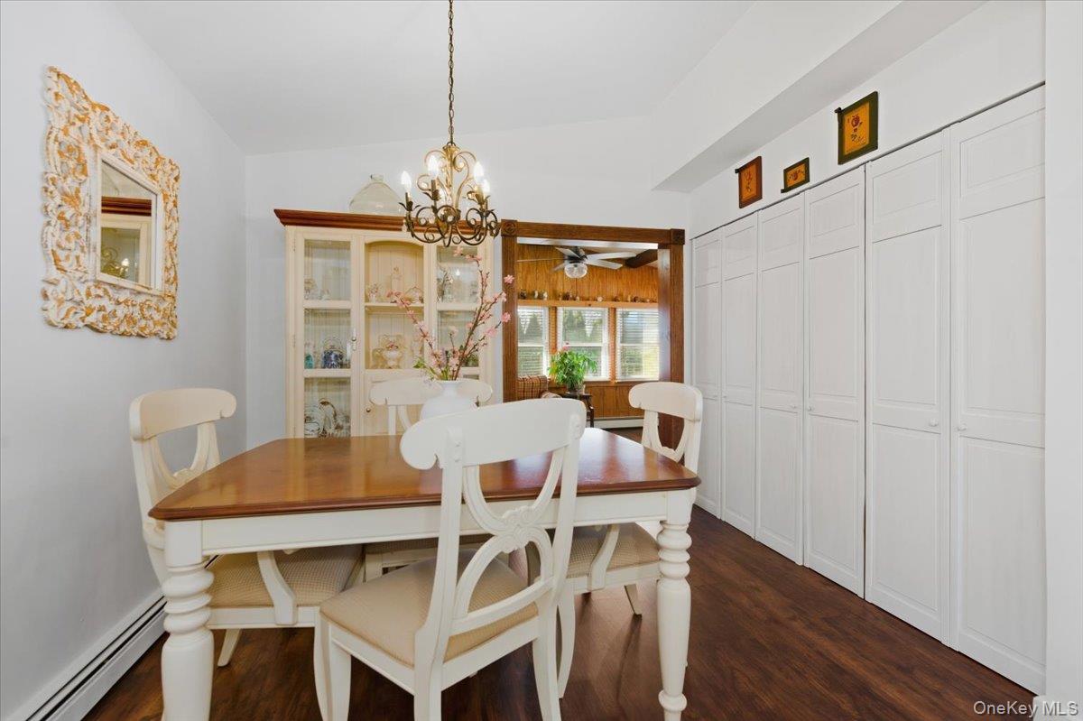 80 Newport Road Island Park, NY 11558 - Photo 6 of 26 a view of a dining room with furniture window and wooden floor