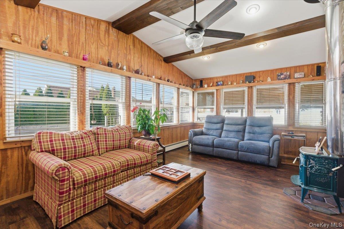 80 Newport Road Island Park, NY 11558 - Photo 9 of 26 a living room with furniture and a large window