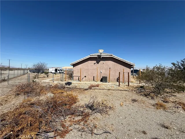 a big house with a big yard and large trees