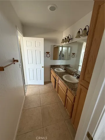 a kitchen with sink cabinets and stove top oven