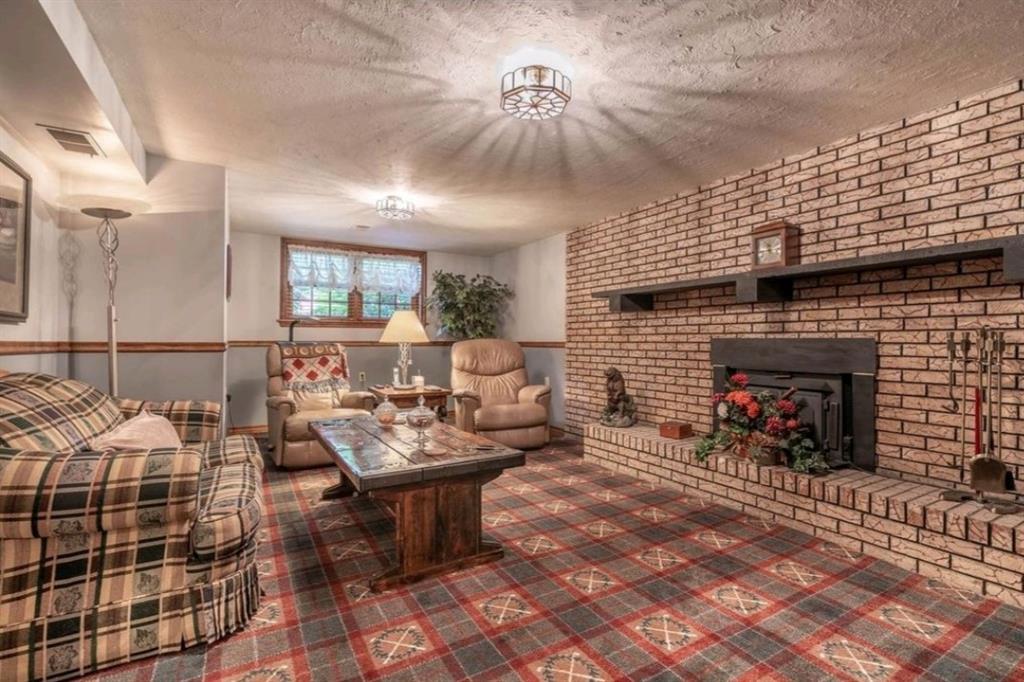 104 Ohare Road Canonsburg, PA 15317 - Photo 17 of 24 comfy lower level family room with wood burning fireplace