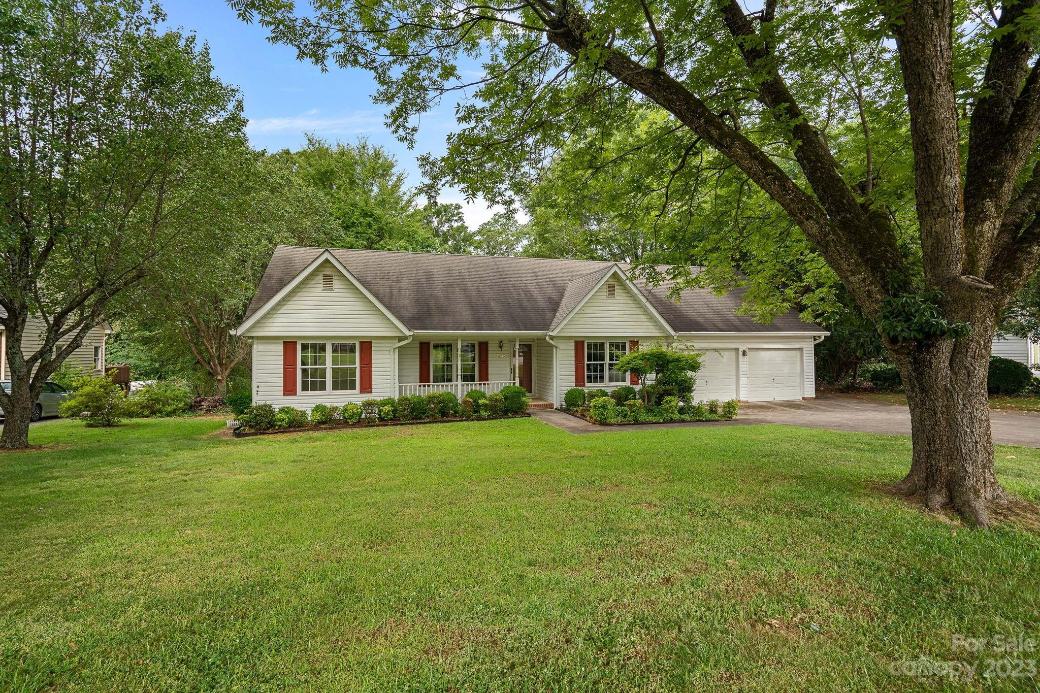 2722 Toddville Road Charlotte, NC 28214 - Photo 1 of 35 a front view of a house with yard and green space