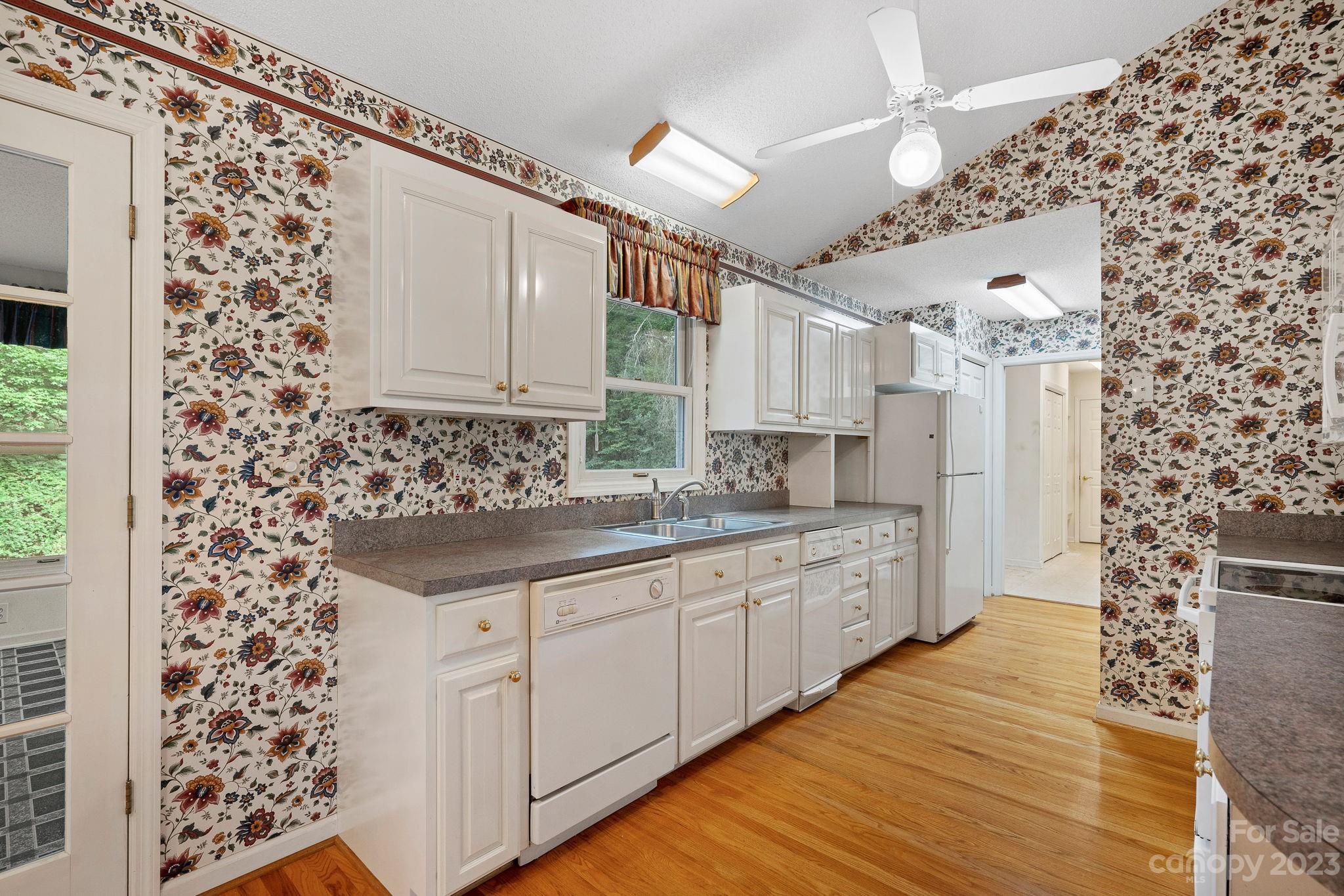 2722 Toddville Road Charlotte, NC 28214 - Photo 12 of 35 a large kitchen with a sink and cabinets