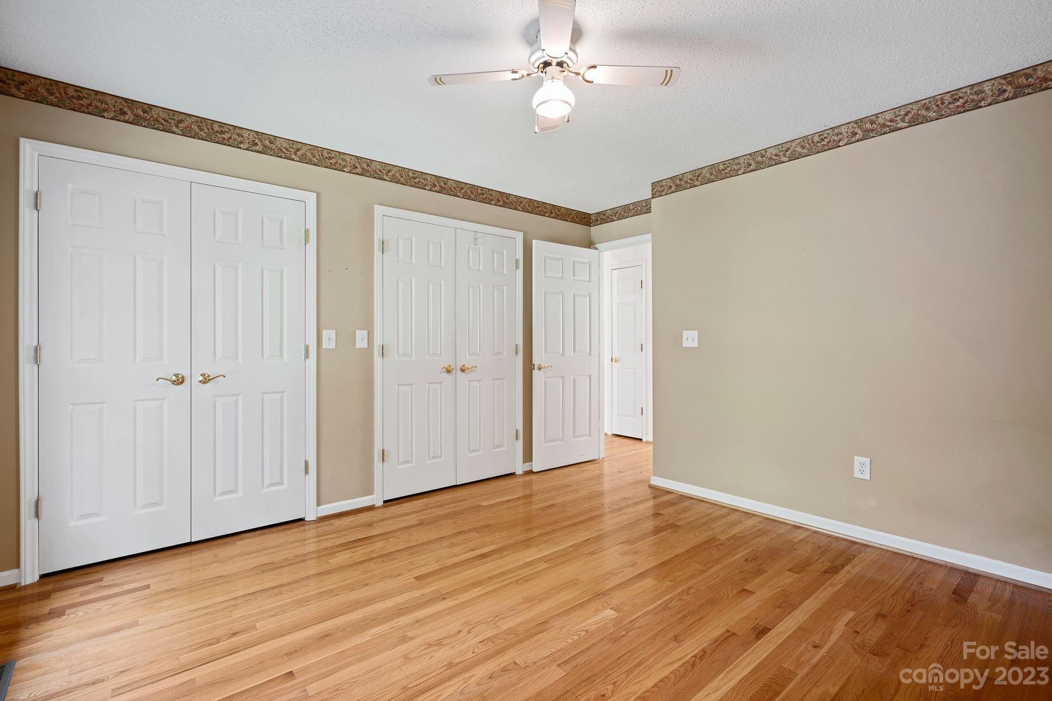 2722 Toddville Road Charlotte, NC 28214 - Photo 21 of 35 a view of an empty room with wooden floor