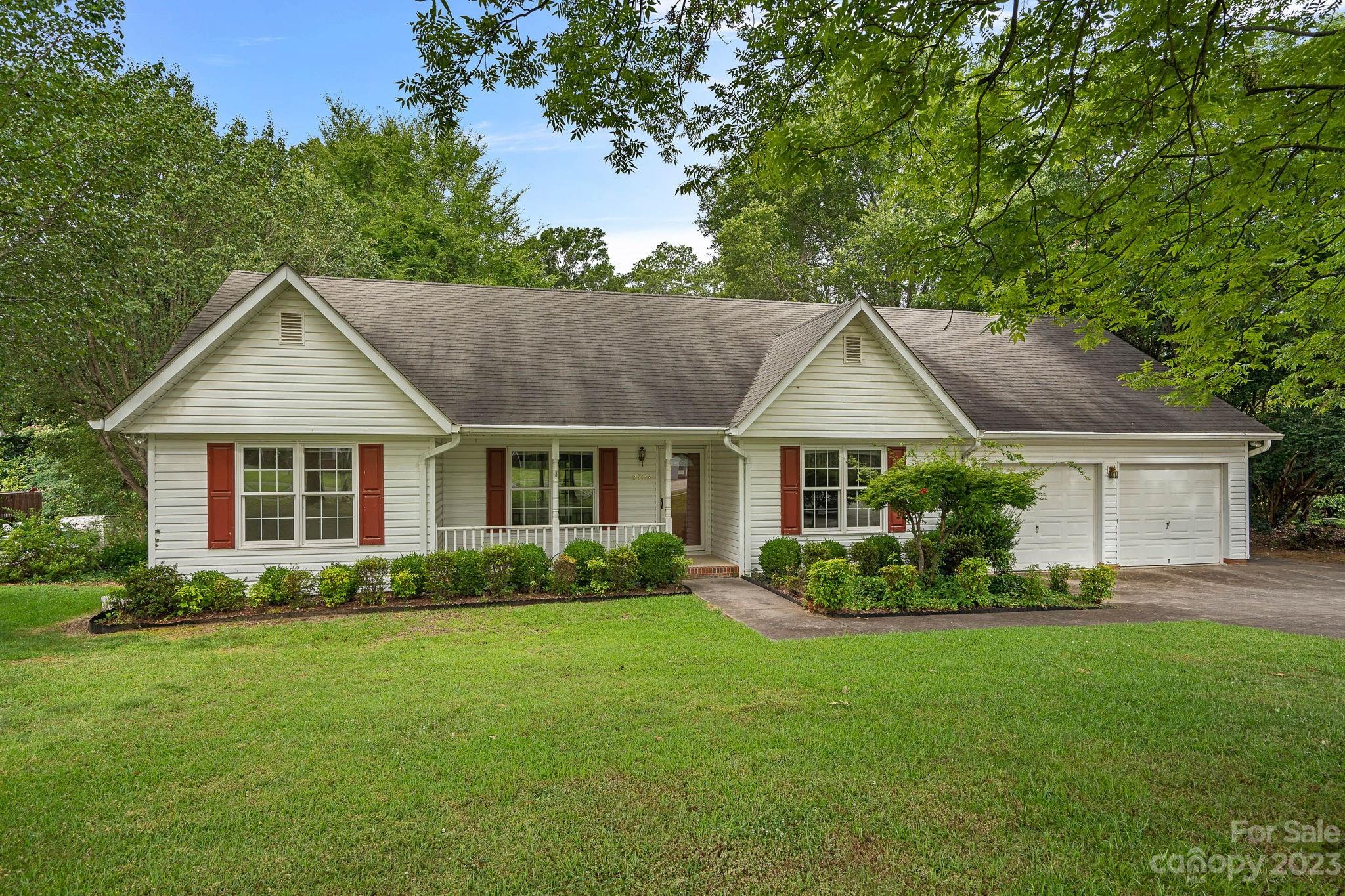 2722 Toddville Road Charlotte, NC 28214 - Photo 27 of 35 a front view of a house with a garden