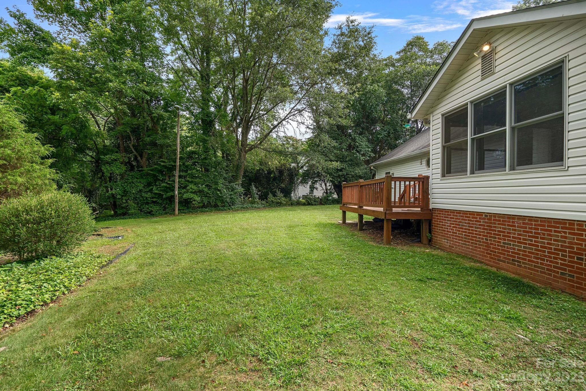 2722 Toddville Road Charlotte, NC 28214 - Photo 32 of 35 a view of a house with backyard and sitting area