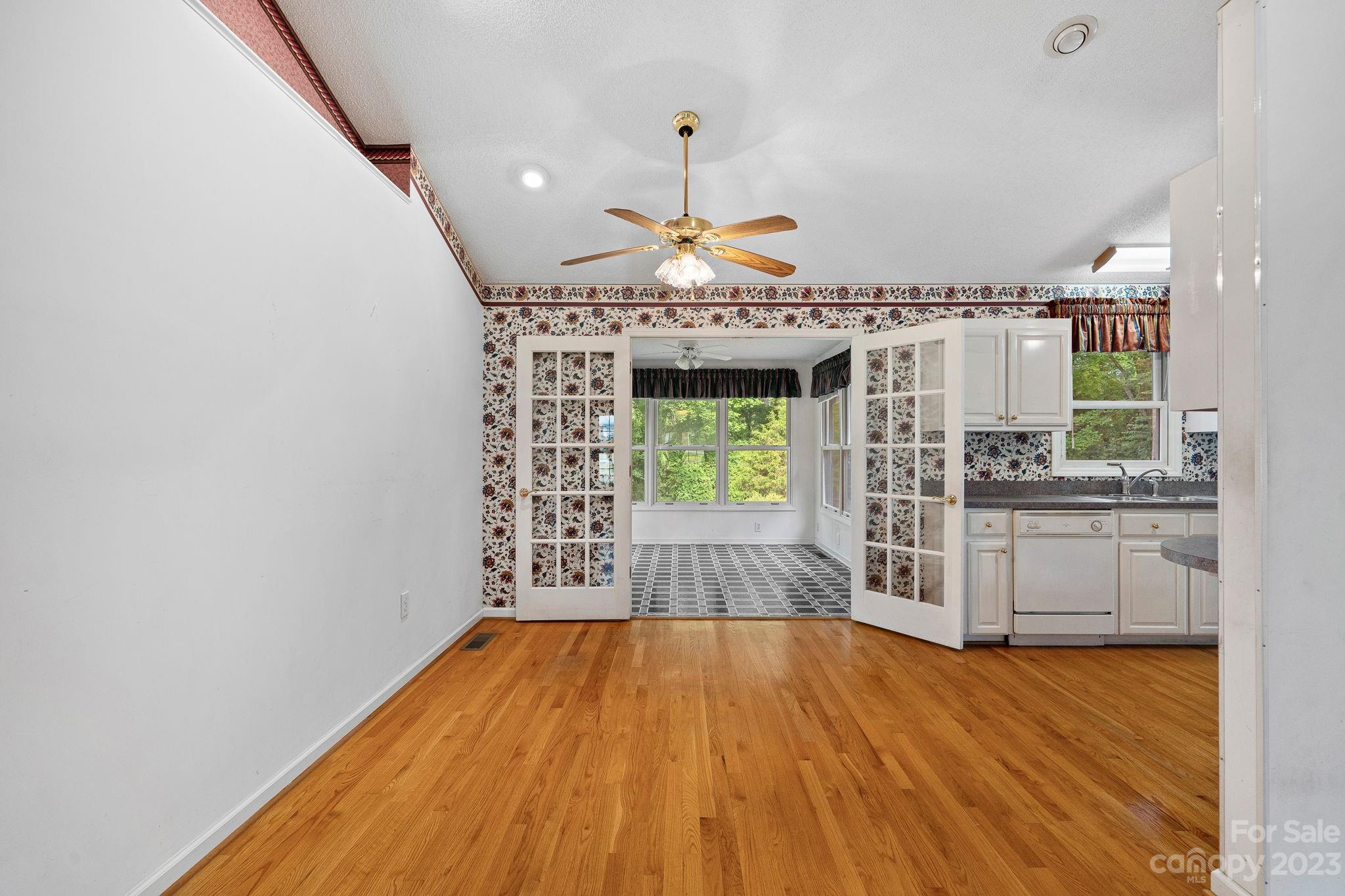 2722 Toddville Road Charlotte, NC 28214 - Photo 6 of 35 wooden floor in an empty room with a window
