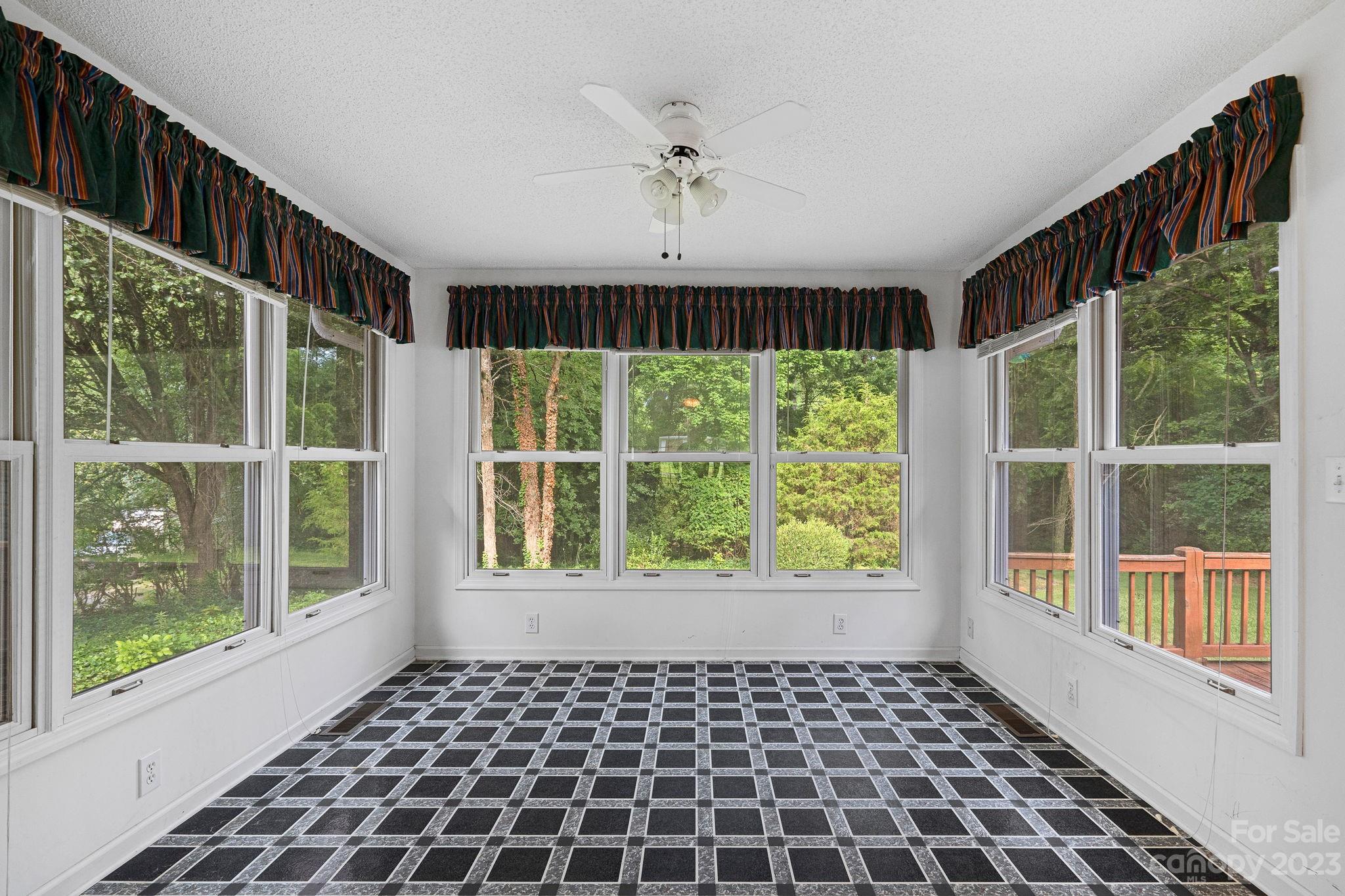 2722 Toddville Road Charlotte, NC 28214 - Photo 7 of 35 a view of a black and white checkered floor with a large window