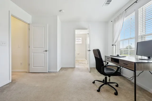 a bathroom with a double vanity sink toilet and a mirror