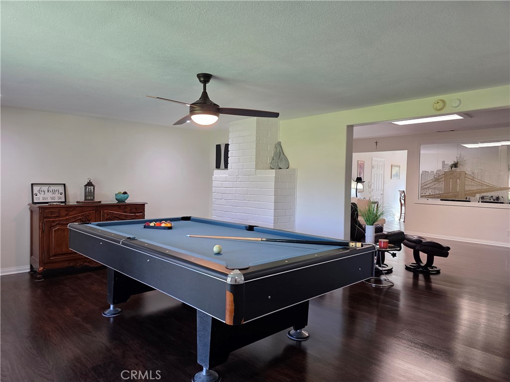 3333 West Keys Lane Anaheim, CA 92804 - Photo 11 of 31 a room with pool table and wooden floor