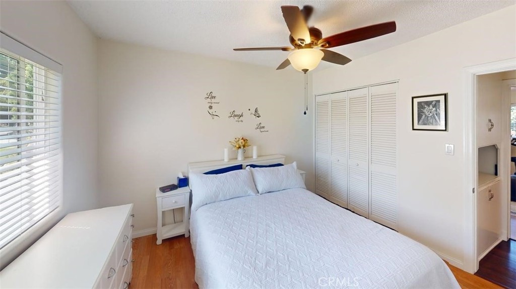 3333 West Keys Lane Anaheim, CA 92804 - Photo 18 of 31 a bedroom with a bed and a ceiling fan