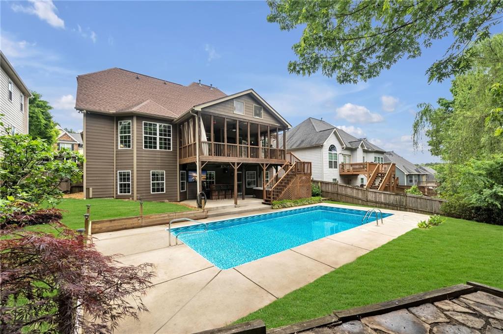 a front view of a house with yard and green space