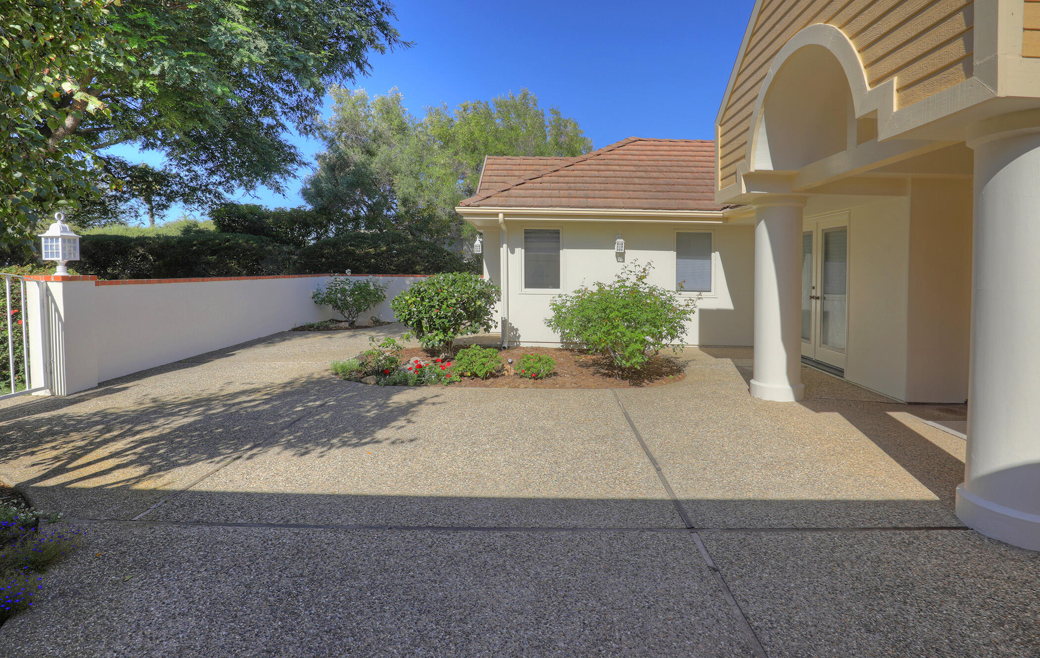 923 Via Los Padres Santa Barbara, CA 93111 - Photo 13 of 36 a front view of a house with a yard and potted plants