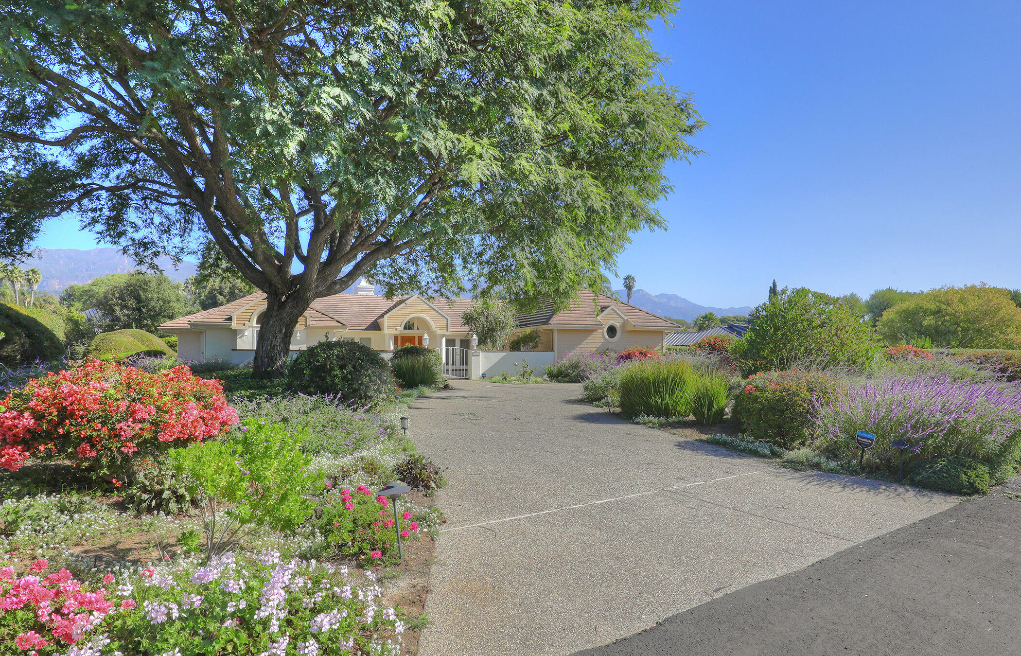 923 Via Los Padres Santa Barbara, CA 93111 - Photo 2 of 36 a front view of a house with a yard and fountain in middle