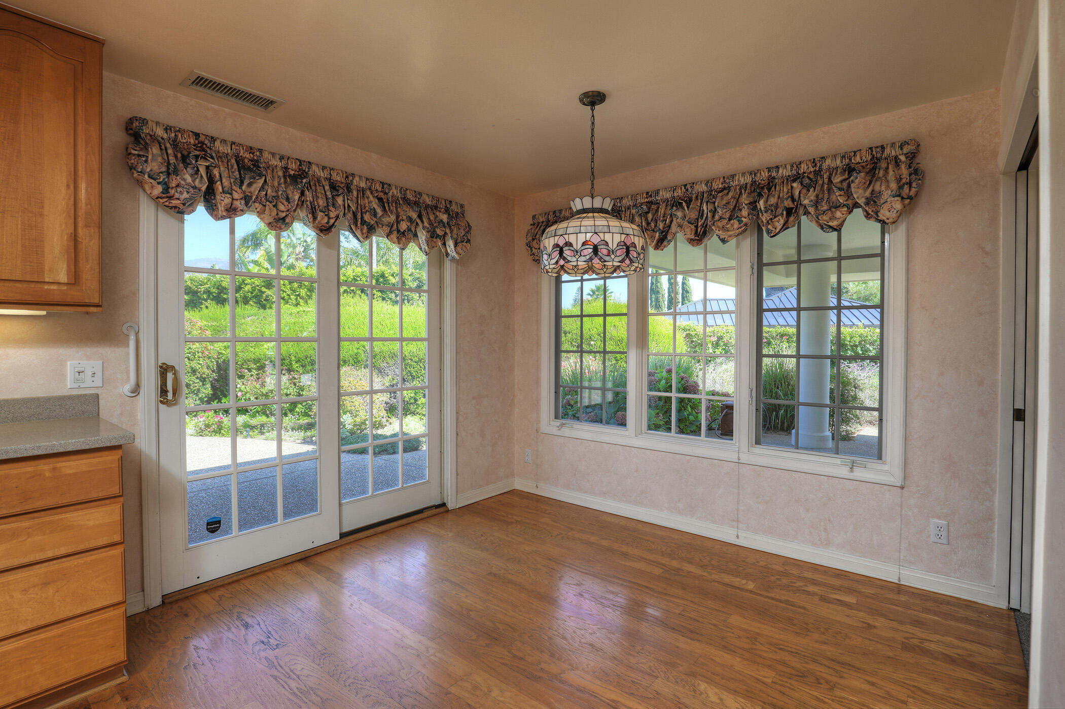 923 Via Los Padres Santa Barbara, CA 93111 - Photo 22 of 36 a view of an empty room with wooden floor and a window