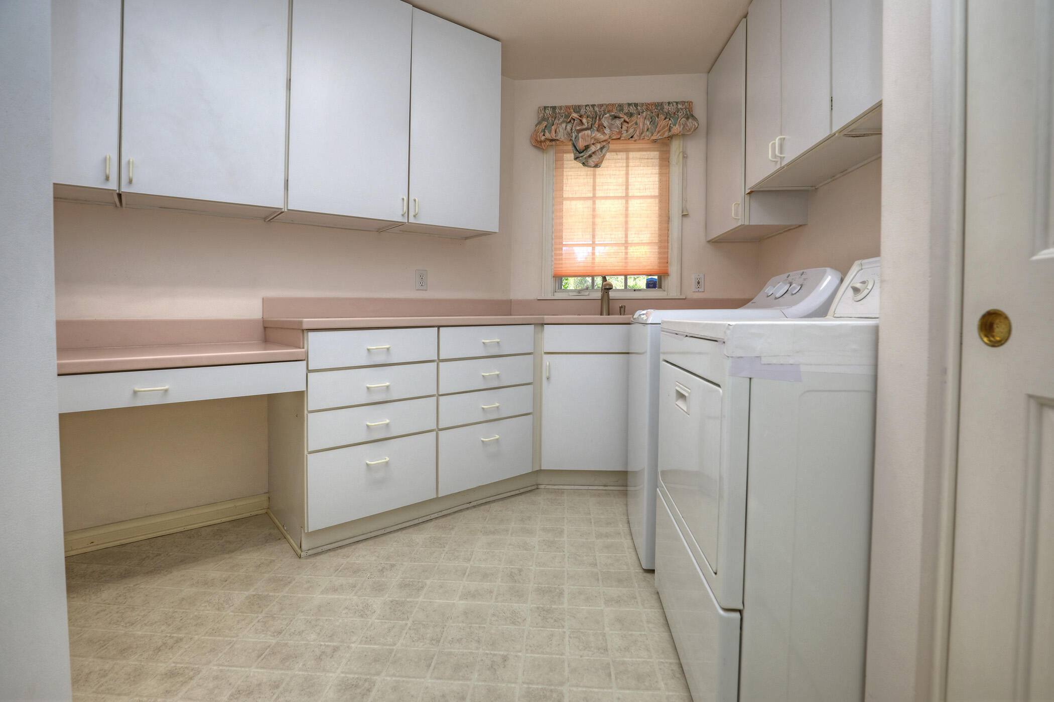 923 Via Los Padres Santa Barbara, CA 93111 - Photo 36 of 36 a kitchen with white cabinets and a window