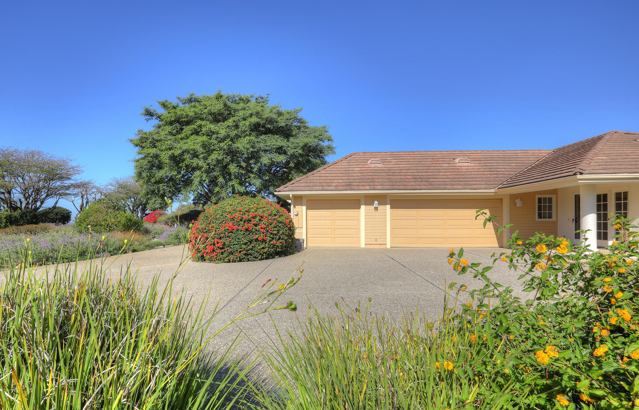 923 Via Los Padres Santa Barbara, CA 93111 - Photo 5 of 36 a front view of a house with a yard and garage