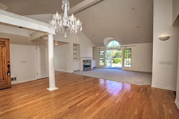 a view of a living room with a fireplace