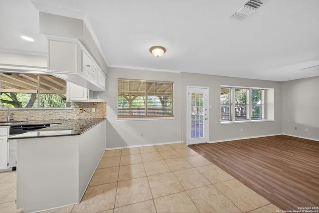 a view of a kitchen with a sink and a window