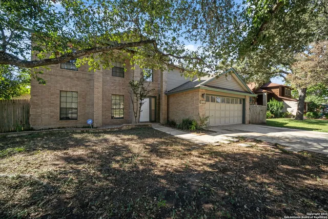 a view of a house with a tree