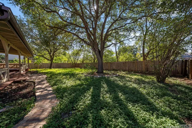 a view of backyard with green space