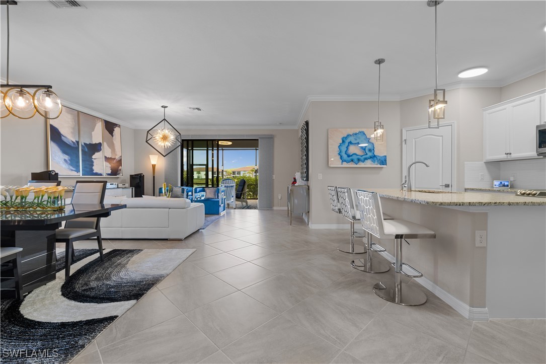 12000 Arbor Trace Drive Fort Myers, FL 33913 - Photo 15 of 50 a living room with furniture and a kitchen view