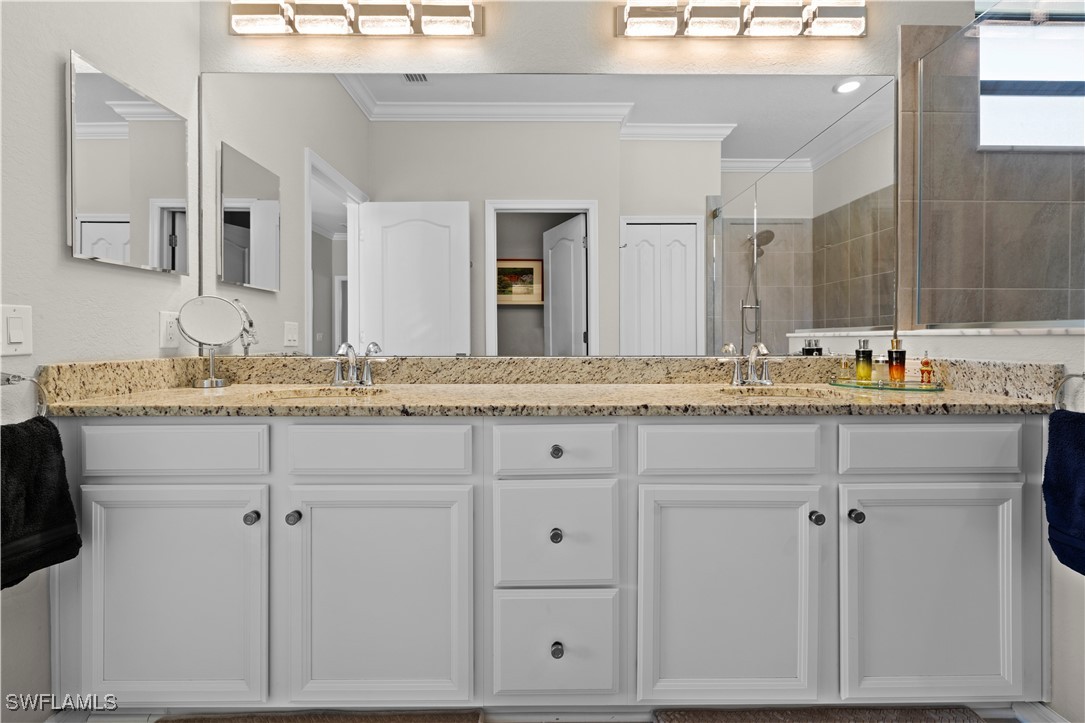 12000 Arbor Trace Drive Fort Myers, FL 33913 - Photo 24 of 50 a bathroom with a sink and a mirror