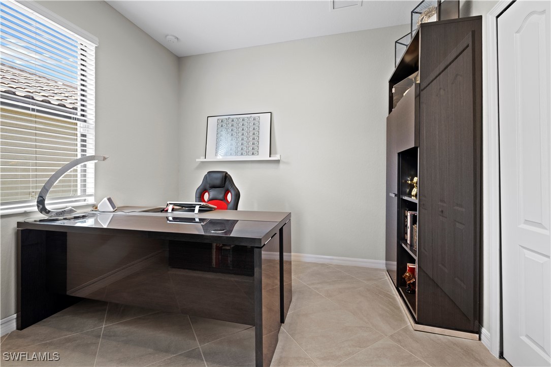 12000 Arbor Trace Drive Fort Myers, FL 33913 - Photo 30 of 50 a view of a workspace with furniture and a window