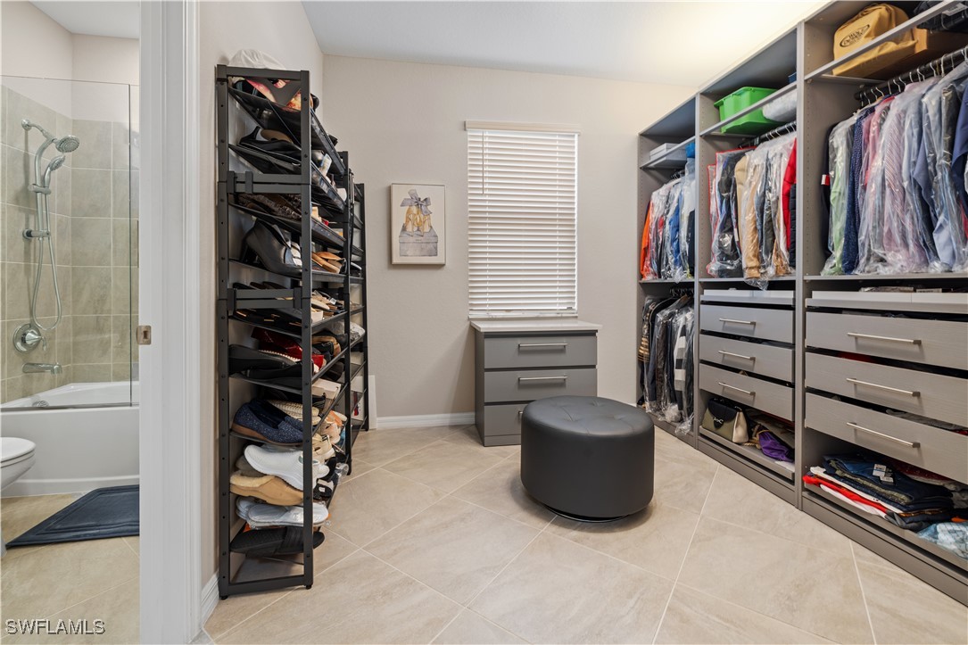 12000 Arbor Trace Drive Fort Myers, FL 33913 - Photo 34 of 50 a view of walk in closet with clothes and shoes