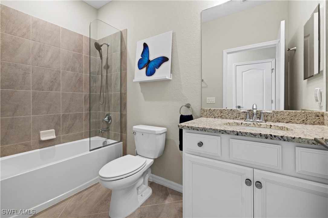 12000 Arbor Trace Drive Fort Myers, FL 33913 - Photo 35 of 50 a bathroom with a granite countertop sink a toilet and shower