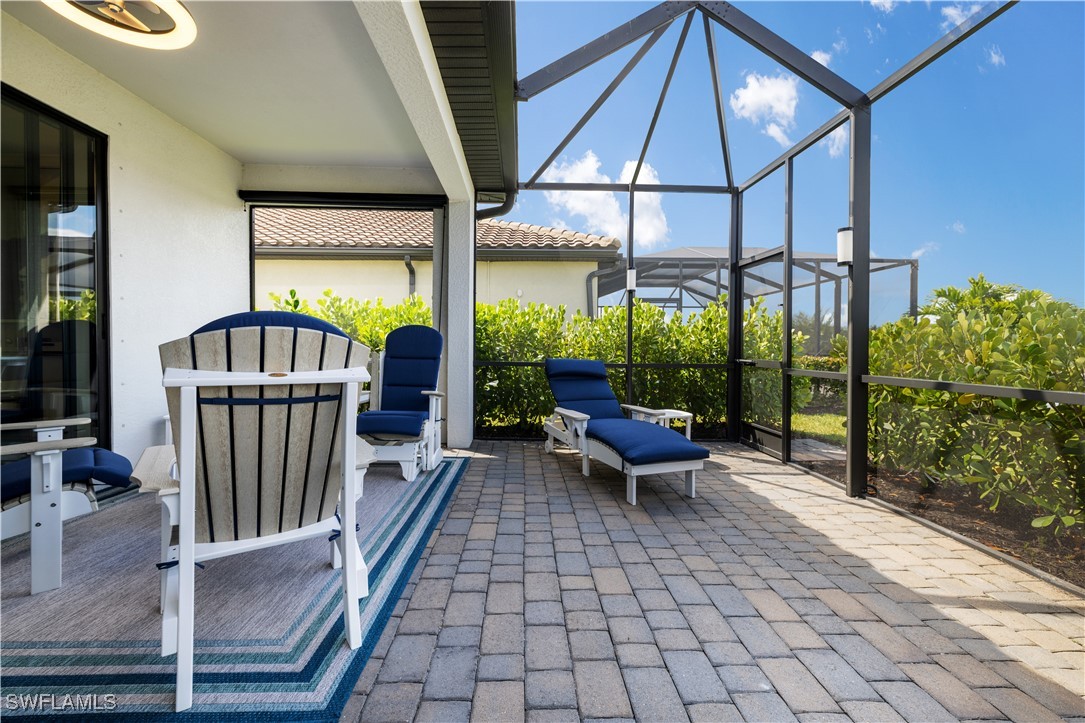 12000 Arbor Trace Drive Fort Myers, FL 33913 - Photo 41 of 50 a view of a patio with a table and chairs
