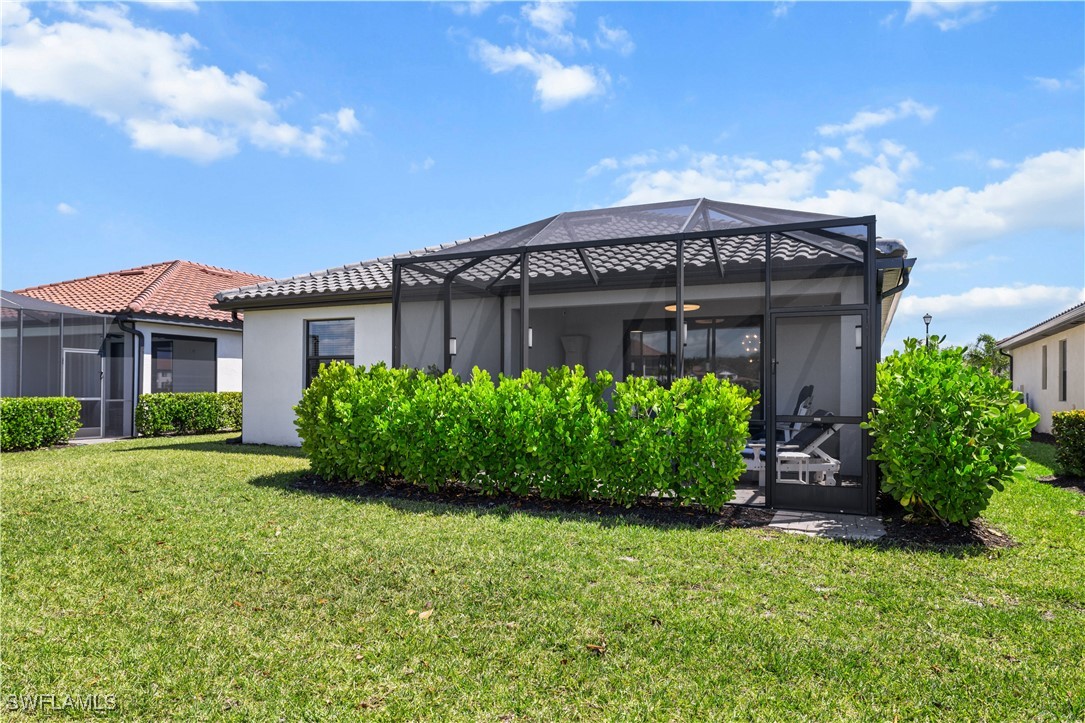12000 Arbor Trace Drive Fort Myers, FL 33913 - Photo 43 of 50 a front view of a house with garden