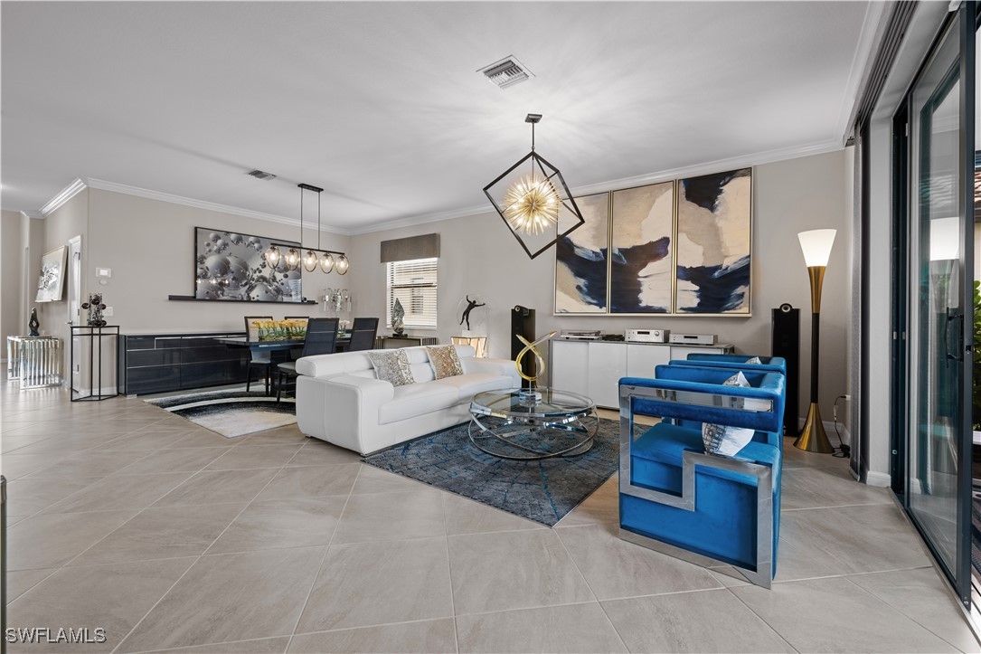 12000 Arbor Trace Drive Fort Myers, FL 33913 - Photo 8 of 50 a living room with furniture fireplace and a view of kitchen