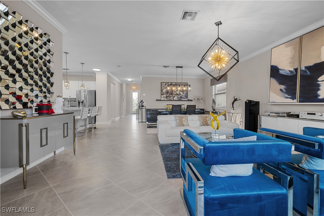 12000 Arbor Trace Drive Fort Myers, FL 33913 - Photo 9 of 50 a view of a dining room with furniture and a kitchen