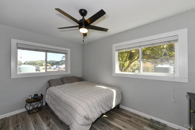 a bedroom with a large bed and a window