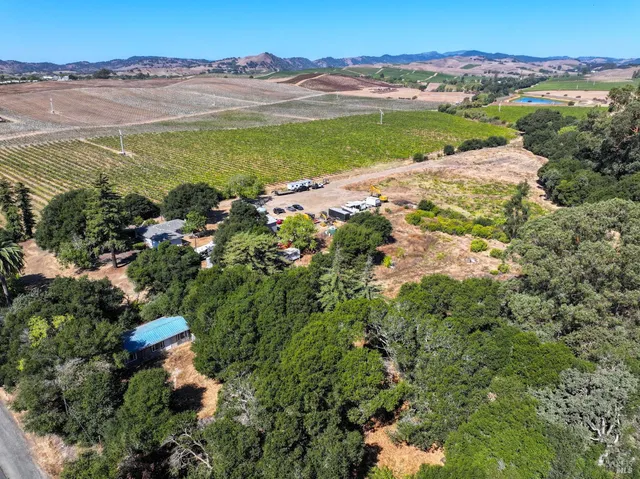 a view of a city with mountains in the background