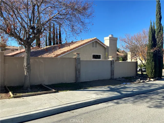 a kitchen with cabinets appliances a sink and a window