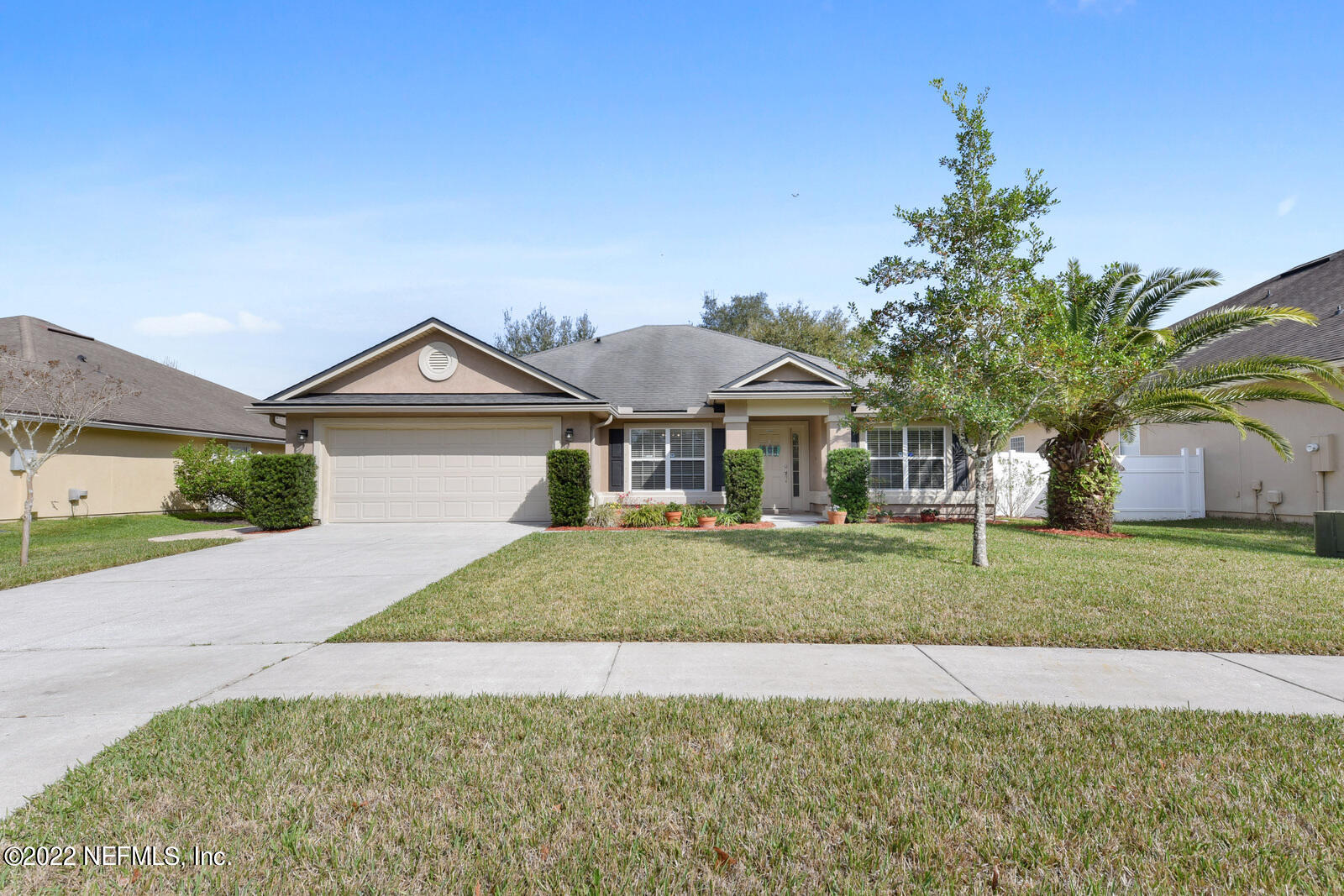 1973 Derringer Road Jacksonville, FL 32225 - Photo 1 of 25 a front view of a house with a yard