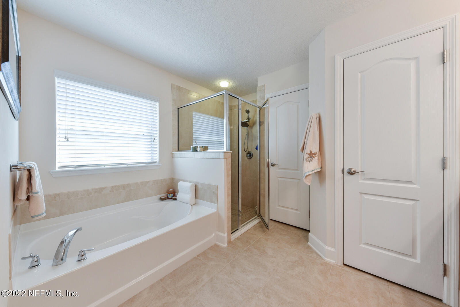 1973 Derringer Road Jacksonville, FL 32225 - Photo 17 of 25 a spacious bathroom with a tub shower and a sink