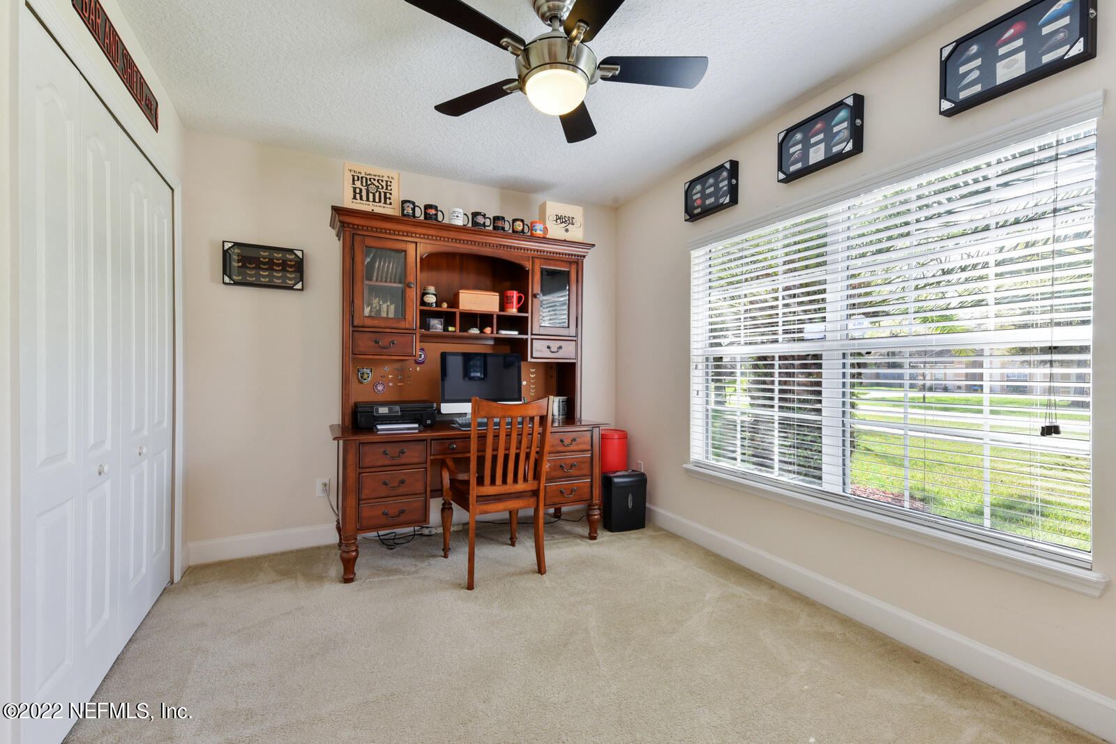 1973 Derringer Road Jacksonville, FL 32225 - Photo 18 of 25 a bedroom with furniture and a window