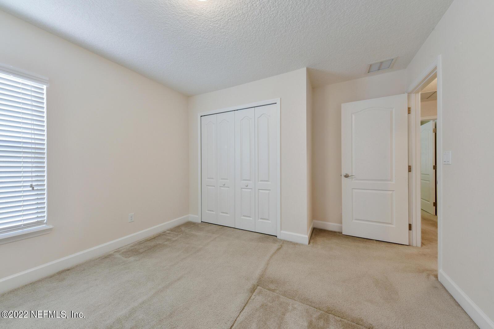 1973 Derringer Road Jacksonville, FL 32225 - Photo 22 of 25 an empty room with windows