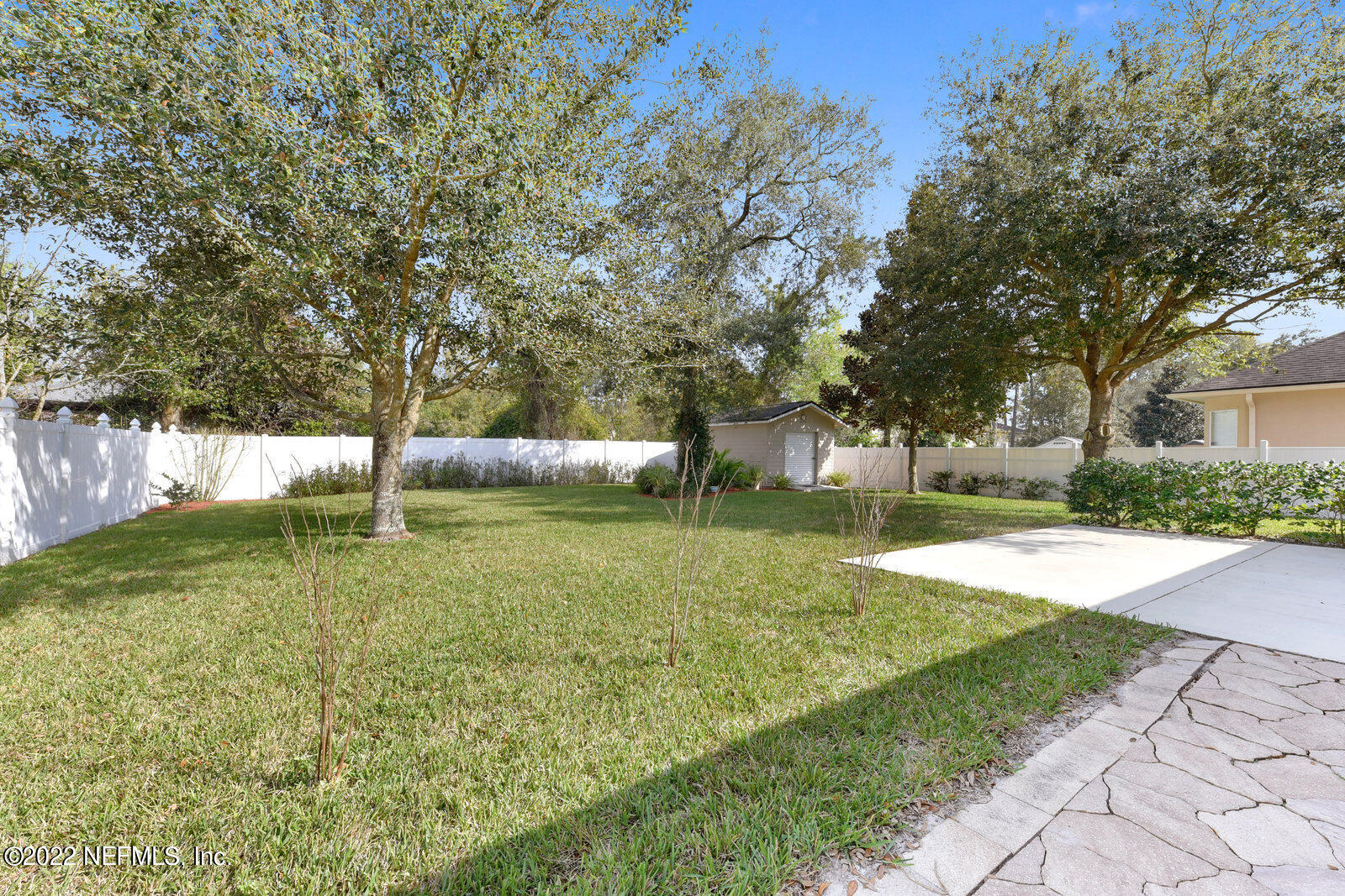 1973 Derringer Road Jacksonville, FL 32225 - Photo 24 of 25 a view of a yard with a large tree