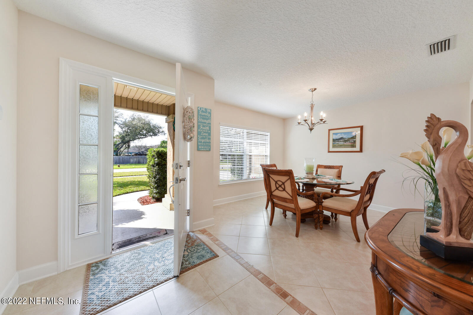 1973 Derringer Road Jacksonville, FL 32225 - Photo 4 of 25 a view of a dining room with furniture window and outside view