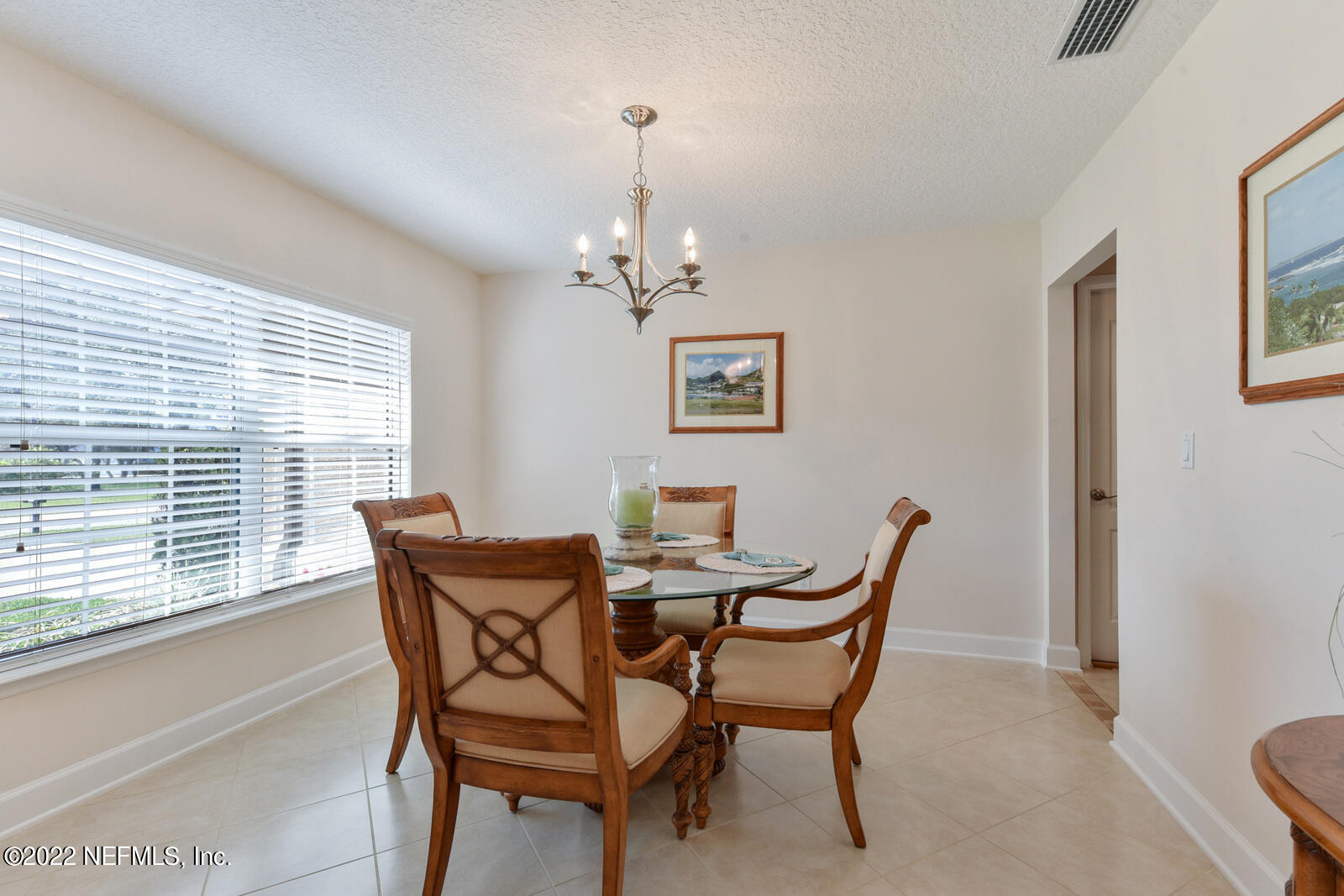 1973 Derringer Road Jacksonville, FL 32225 - Photo 5 of 25 a view of a dining room with furniture wooden floor and a window
