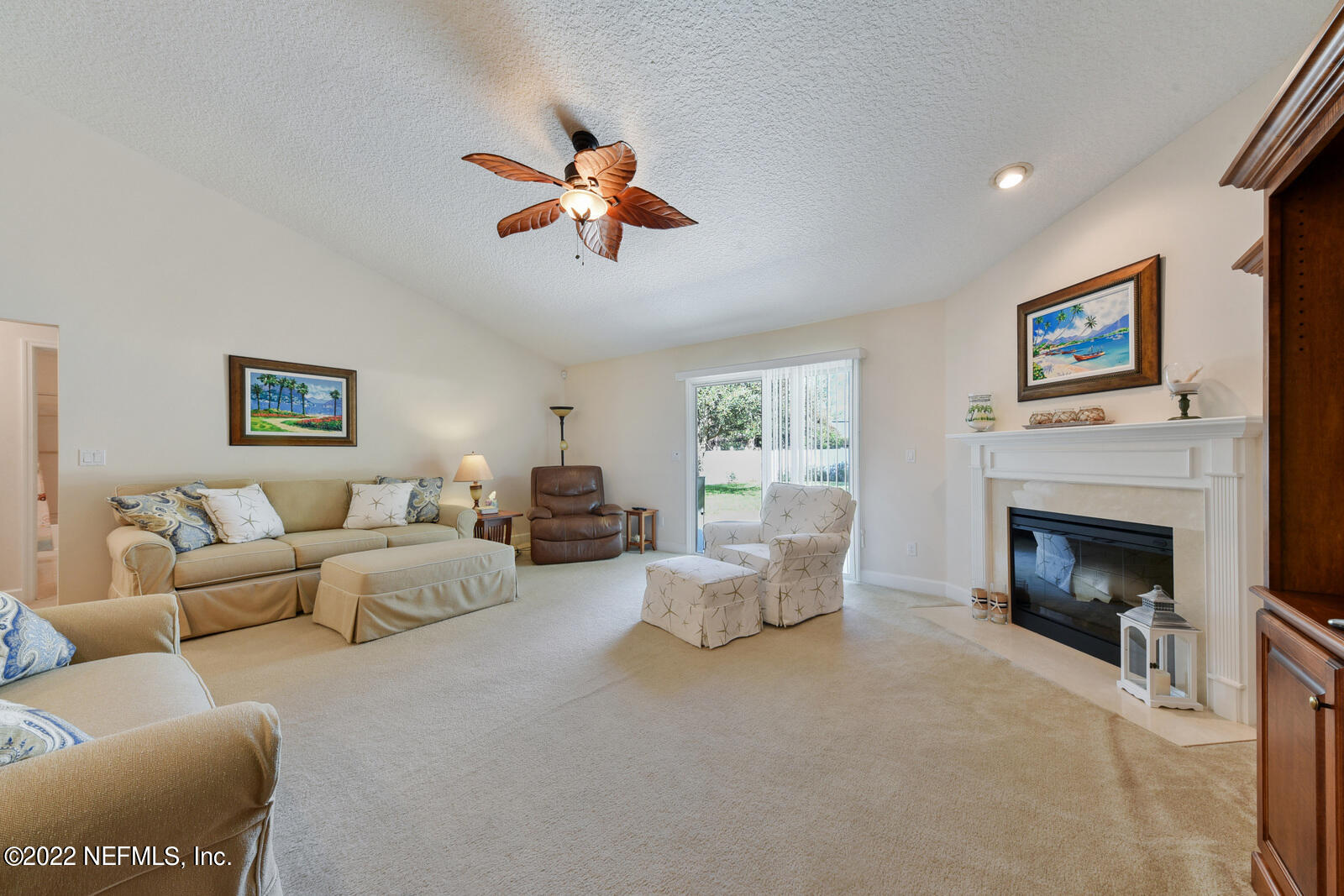 1973 Derringer Road Jacksonville, FL 32225 - Photo 6 of 25 a living room with furniture and a fireplace