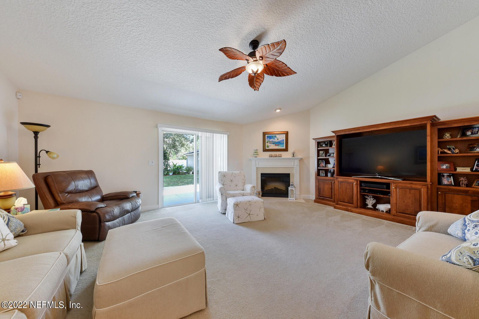 1973 Derringer Road Jacksonville, FL 32225 - Photo 7 of 25 a living room with furniture and a flat screen tv