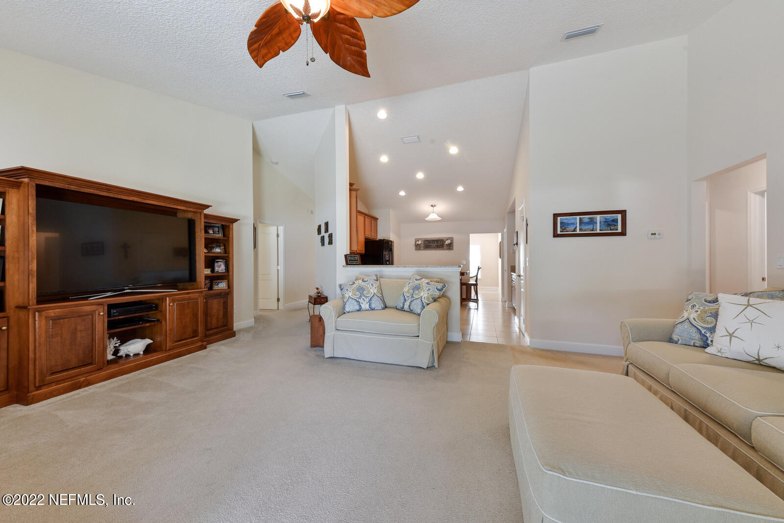 1973 Derringer Road Jacksonville, FL 32225 - Photo 9 of 25 a living room with furniture and a flat screen tv
