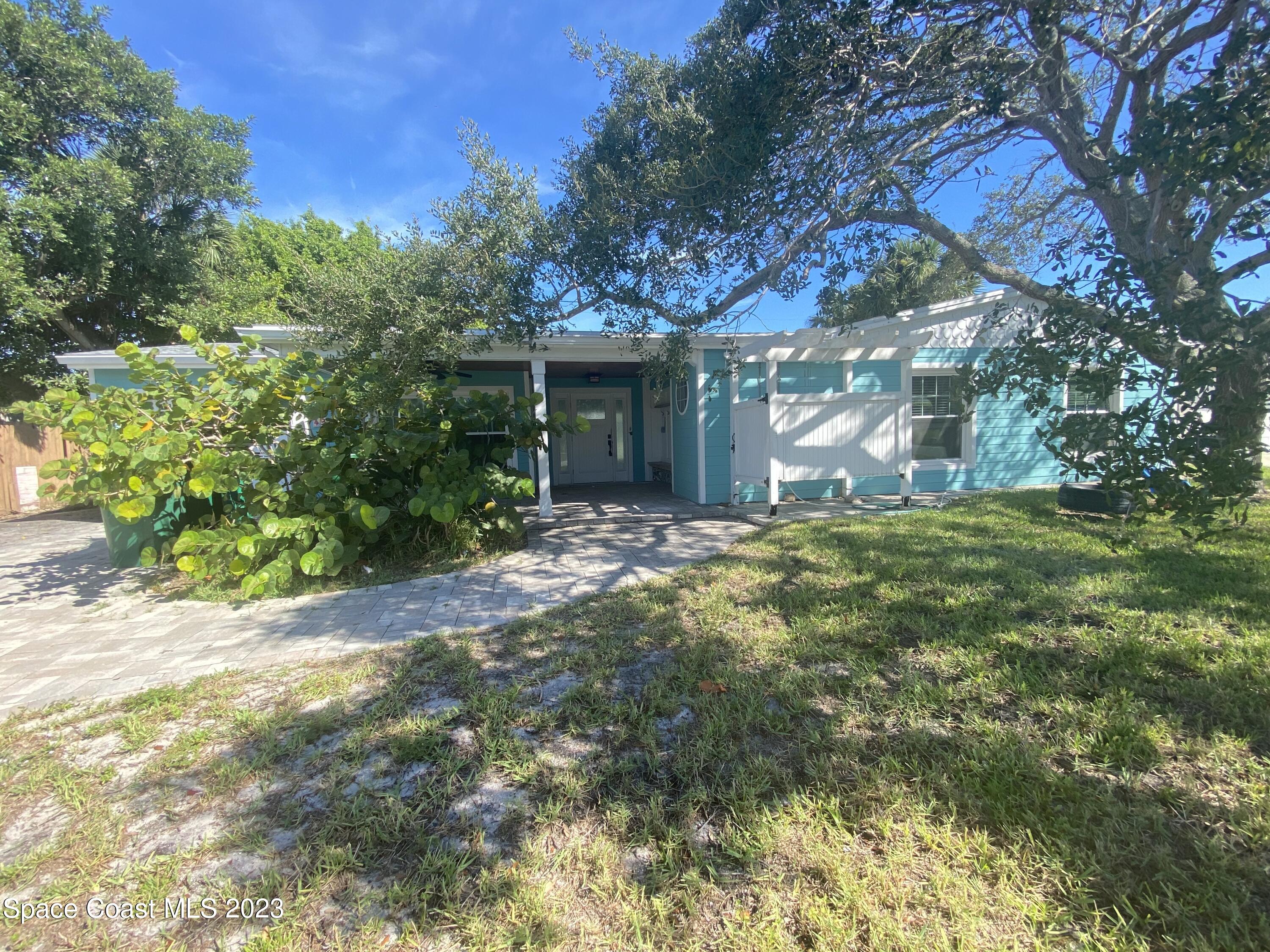 433 Blakey Boulevard Cocoa Beach, FL 32931 - Photo 1 of 15 a view of a house with a tree