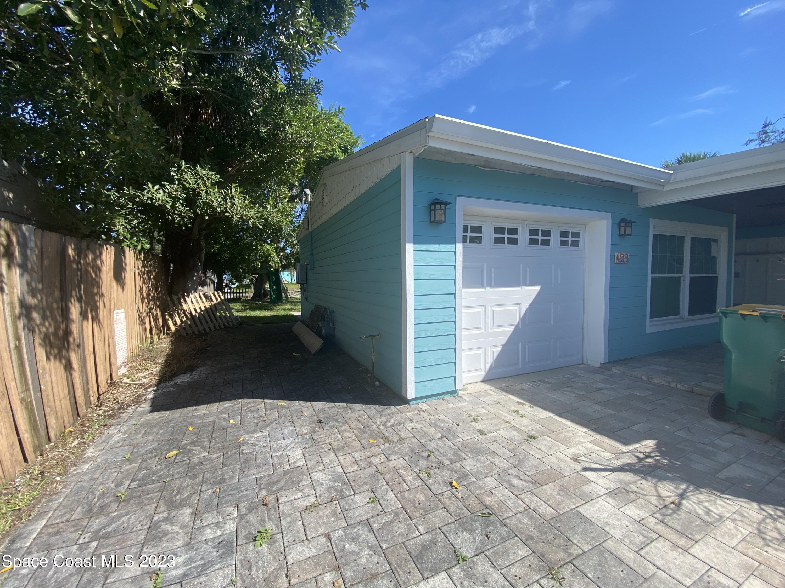 433 Blakey Boulevard Cocoa Beach, FL 32931 - Photo 15 of 15 a view of a house with a yard